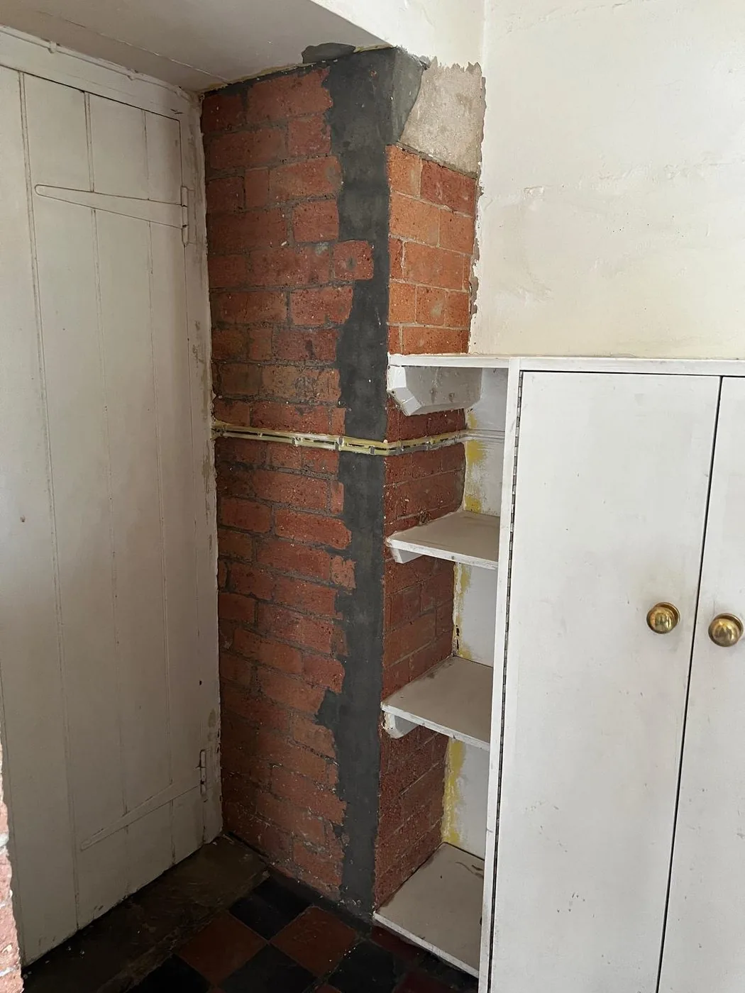 Restored fireplace brickwork showing clear texture and reclaimed character