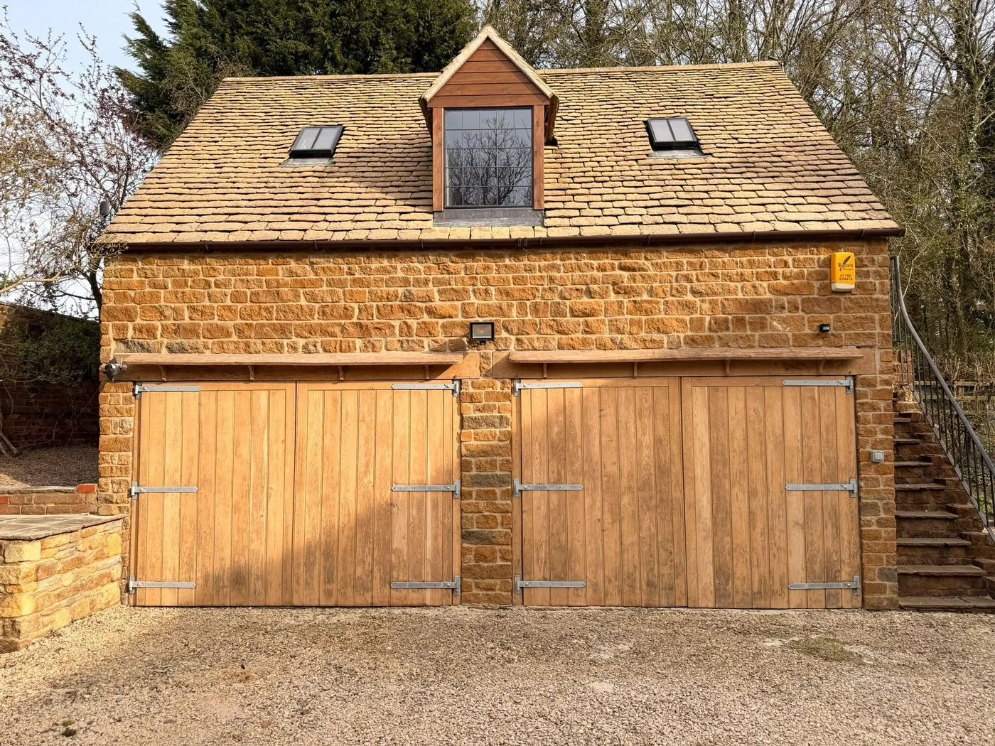 Restored oak garage door with clean grain and refreshed protective finish