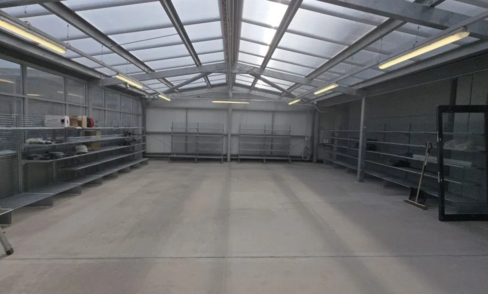 Clean even warehouse floor after gentle coating removal and surface preparation