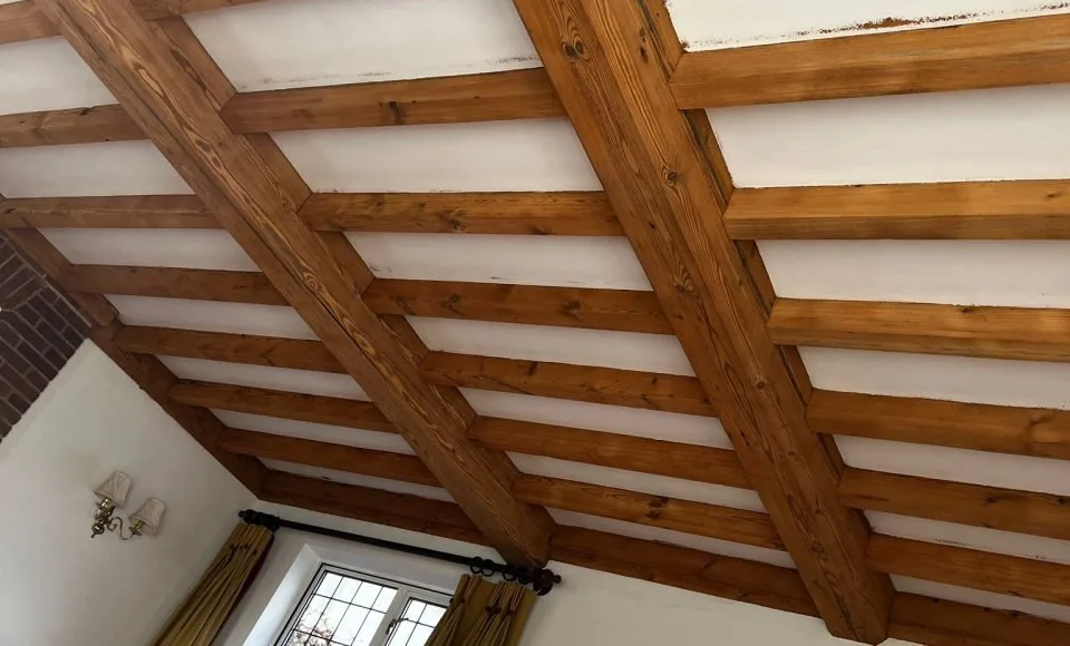 Living room ceiling beams with a clean even finish and enhanced natural timber character