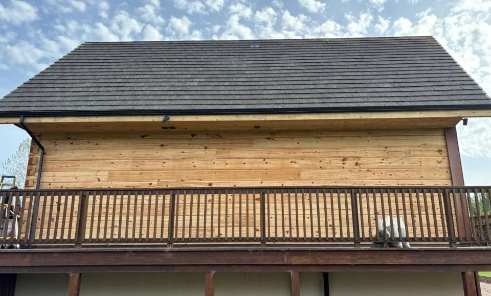 Additional view of the restored timber-clad residential building