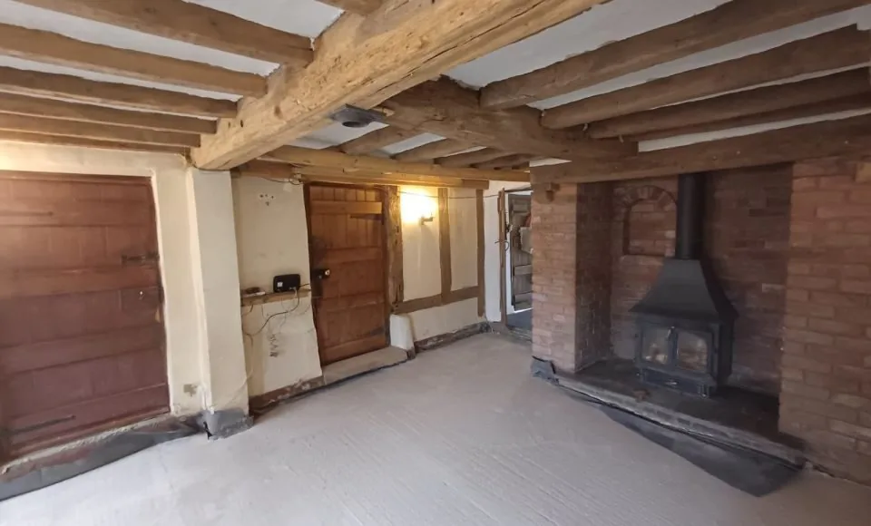 Brighter defined brick fireplace after controlled coating and soot removal