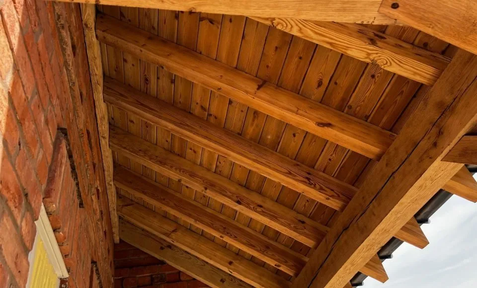 Clean exterior porch frame with an even bright timber appearance after treatment