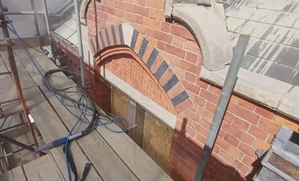 Cleaned exterior brick and stone elevation with a brighter even finish