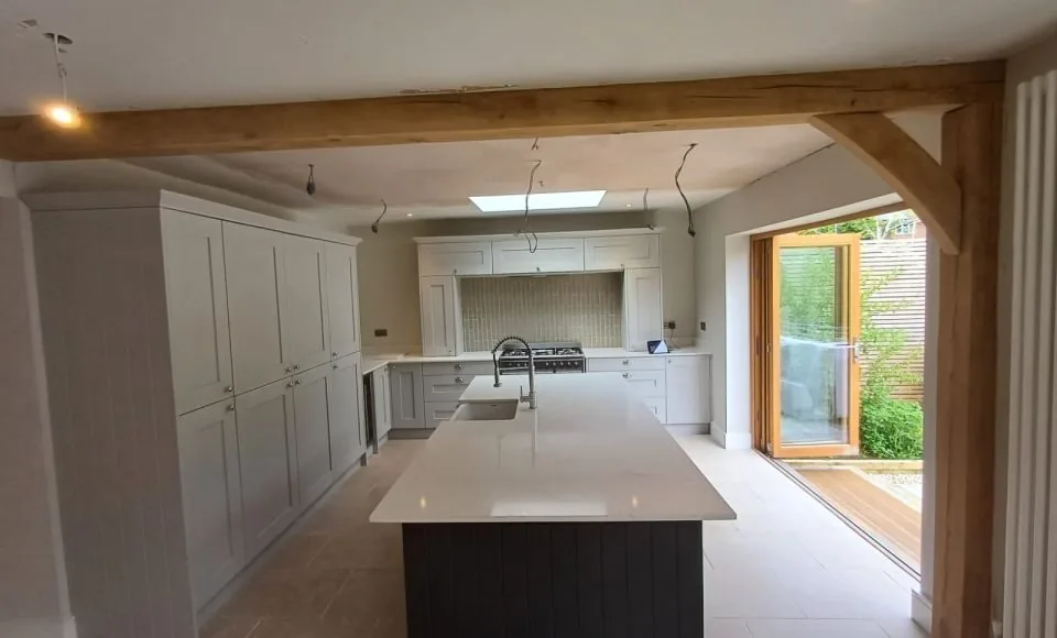 Lightened oak kitchen beams with a cleaner contemporary finish