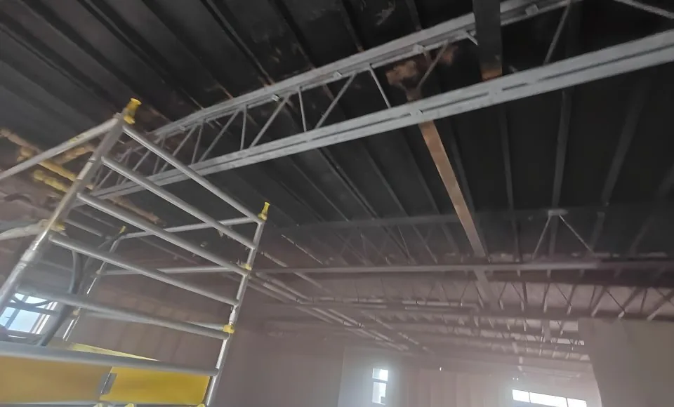 Restored steel structure showing reduced surface staining and a consistent clean finish