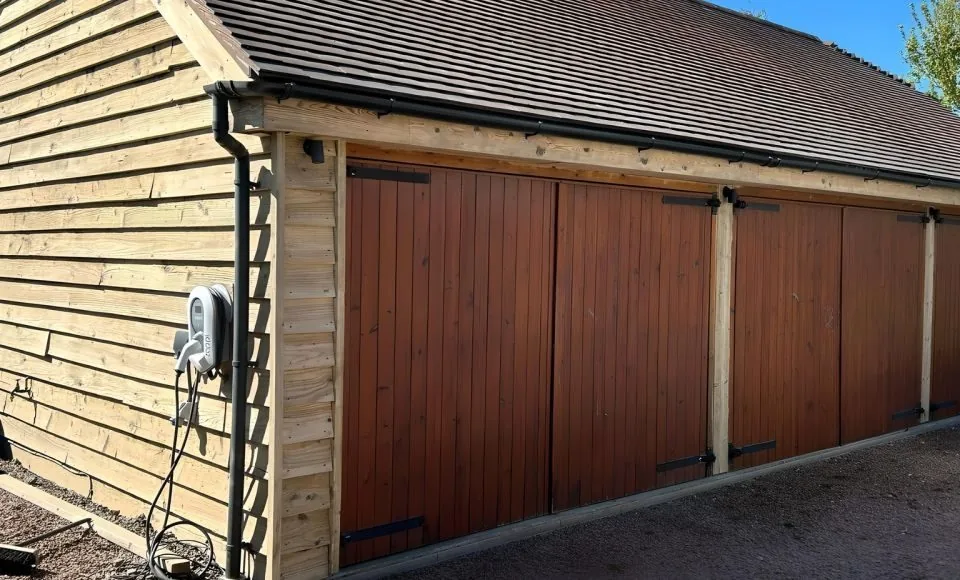 Outbuilding elevation after gentle preparation with a cleaner, more uniform surface ready for coating