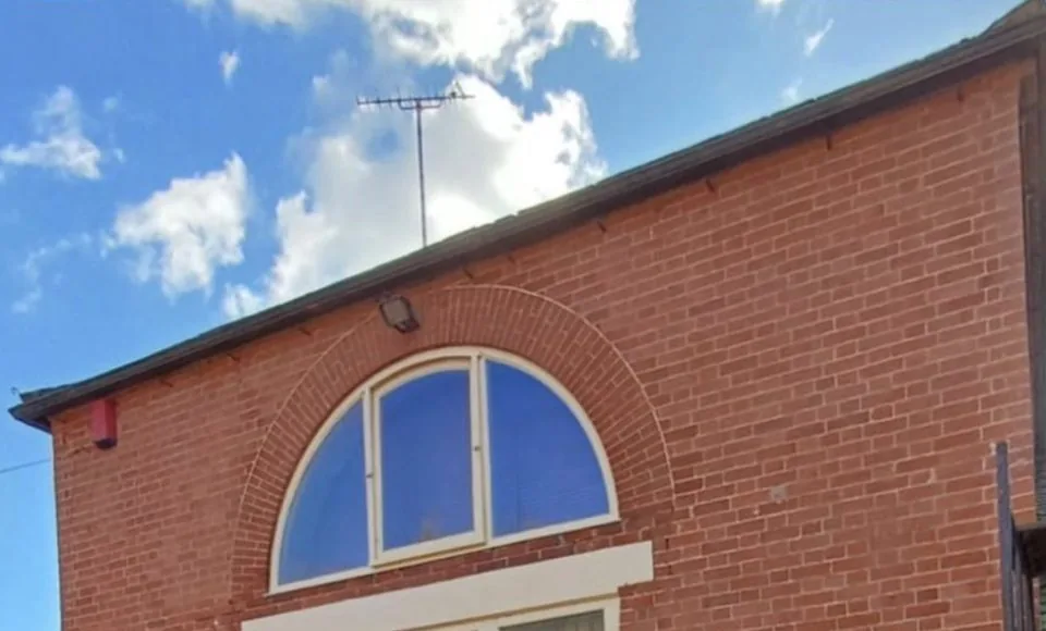 Refreshed brick and stone house exterior with a cleaner near-new appearance
