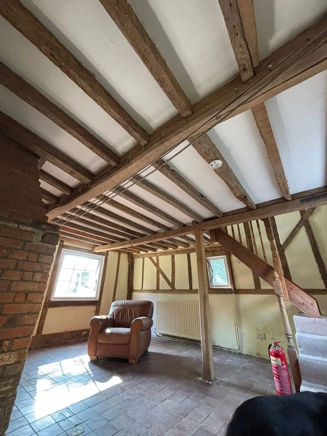 Historic cottage oak frame after restoration with aged natural timber character revealed