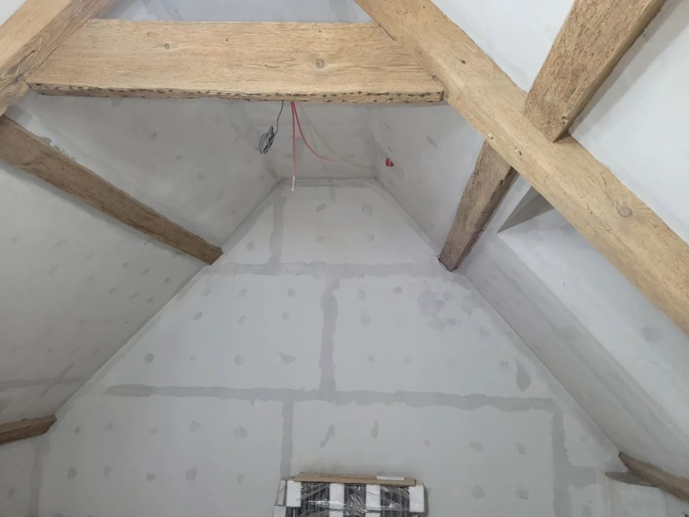 Clean restored oak beams showing clearer grain and renewed natural character