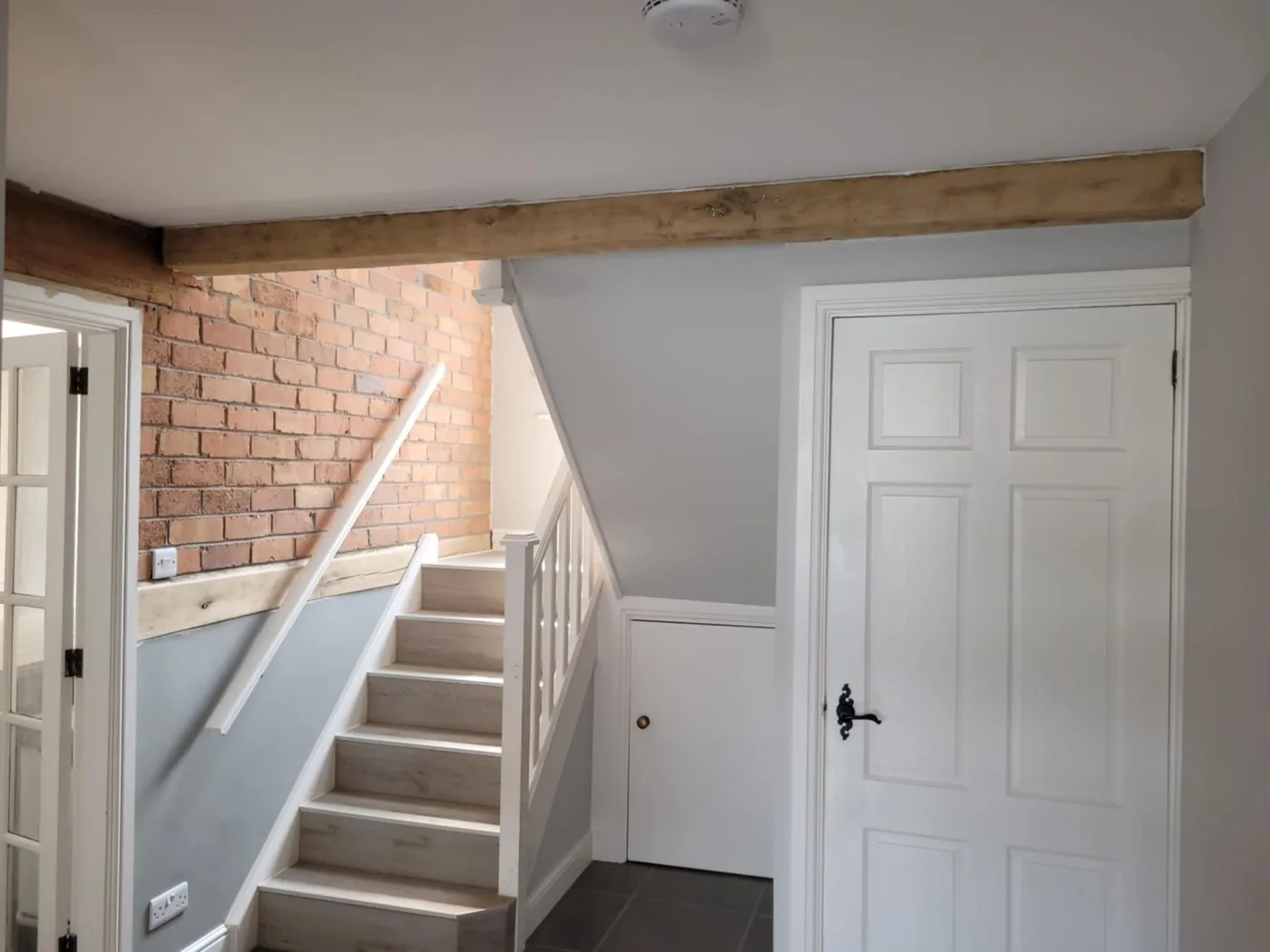 Restored inglenook and red brick showing clear original texture