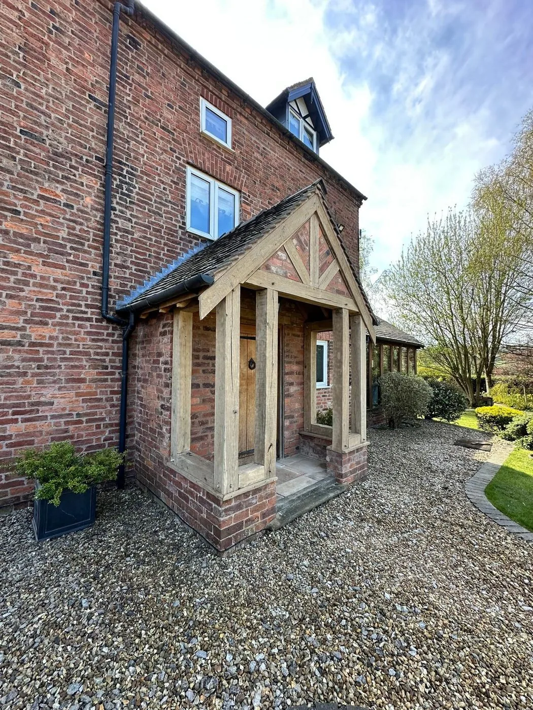 Clean oak porch frame with natural grain visible after surface restoration