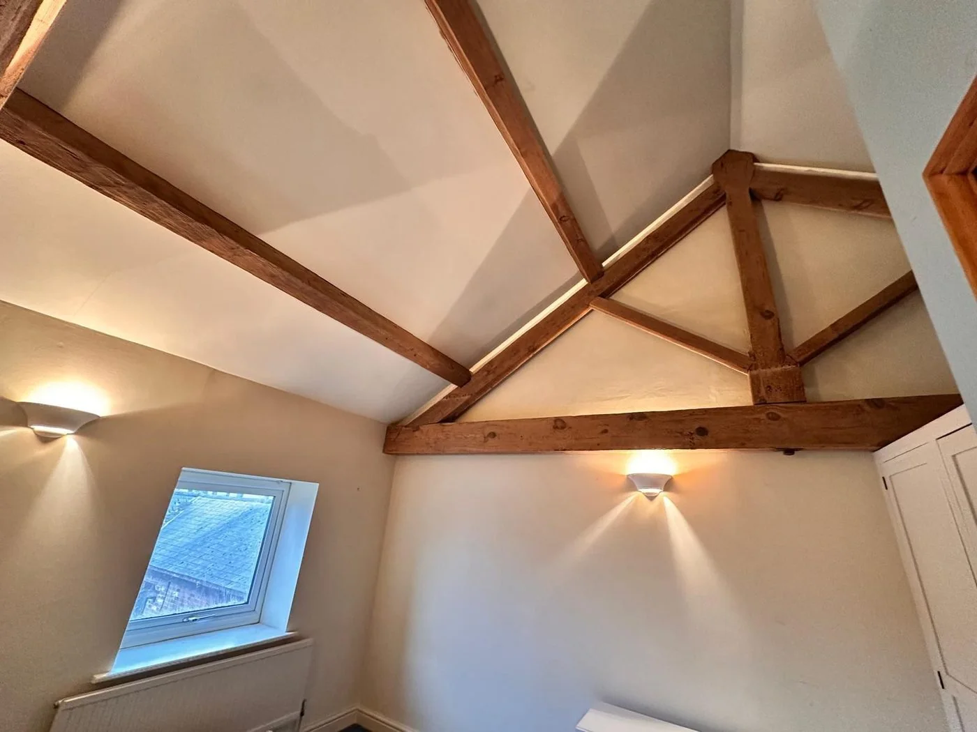 Additional restored view of vaulted ceiling beams in a loft conversion