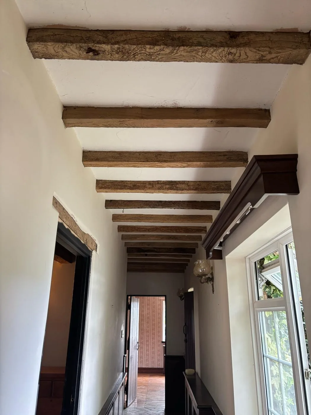 Cleaned oak support beam complementing the traditional cottage interior