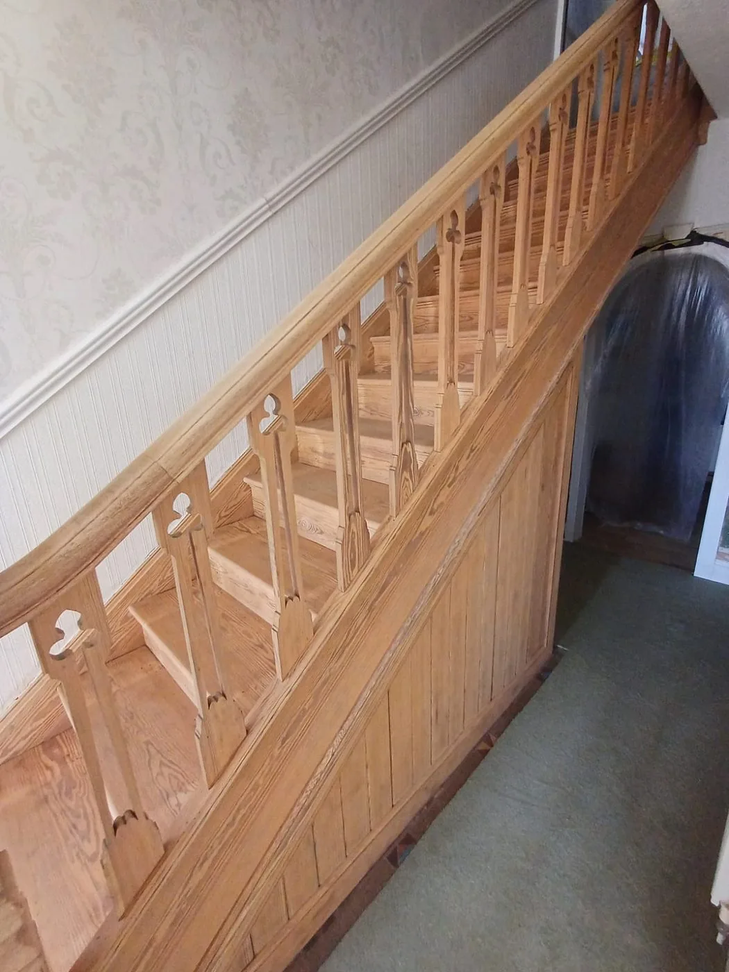 Close restoration view of Victorian newel post and balusters with coating removed and timber detail preserved