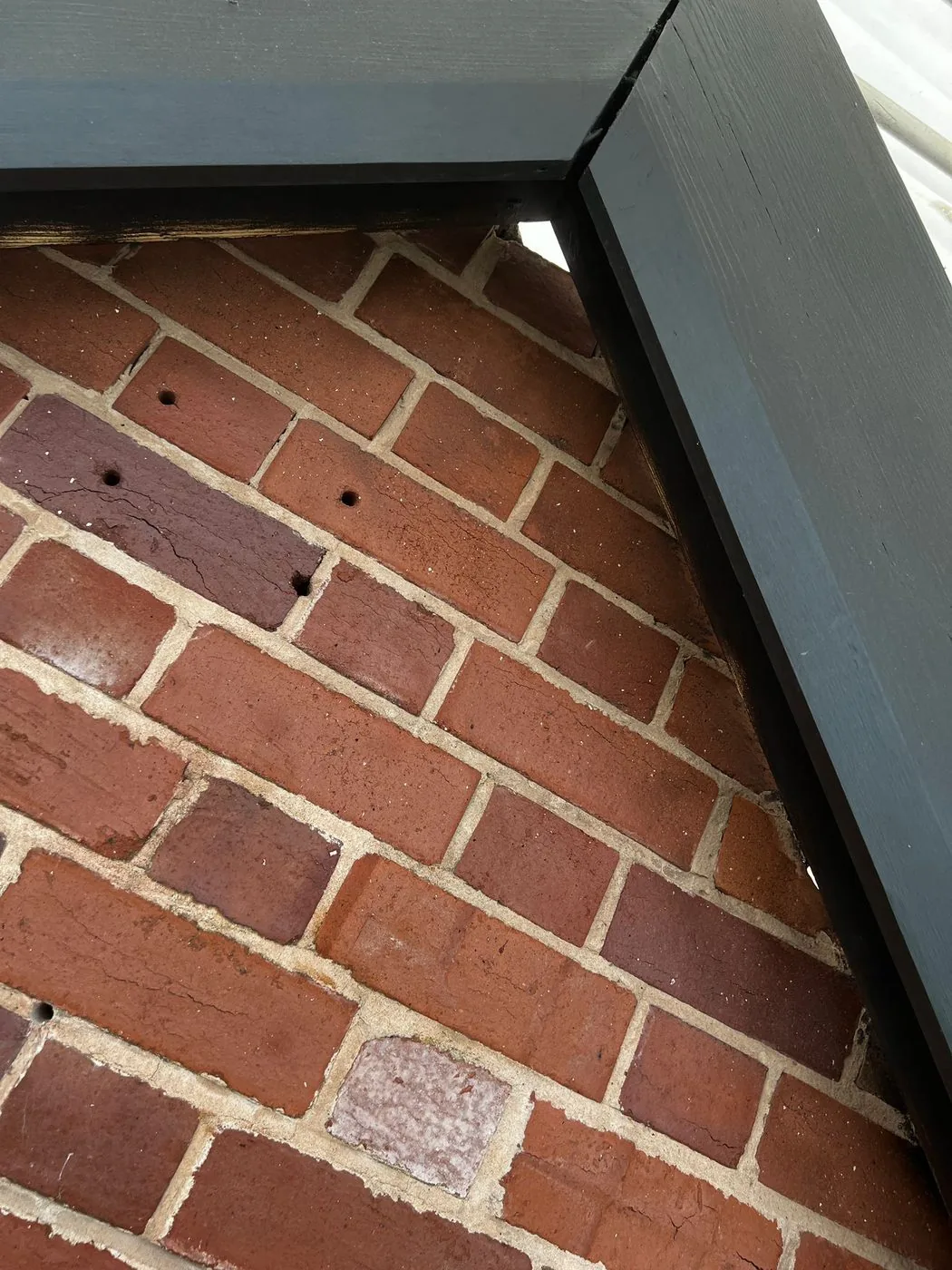Restored roof brickwork and cleaner timber rafters showing a more even post-fire surface