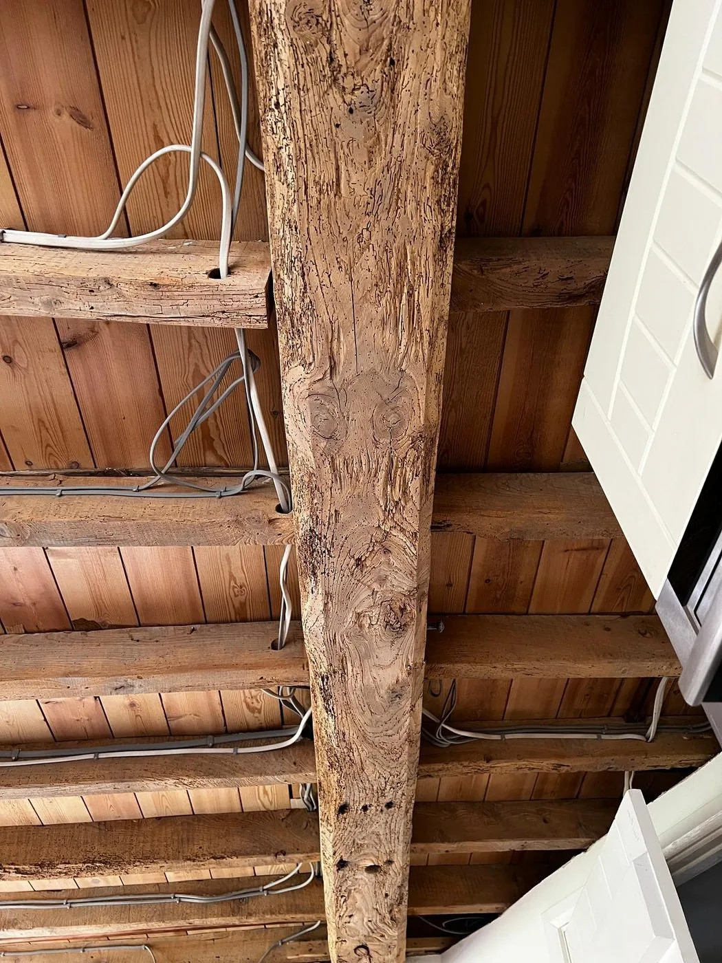 Detailed restored oak beam showing an even surface and preserved timber character