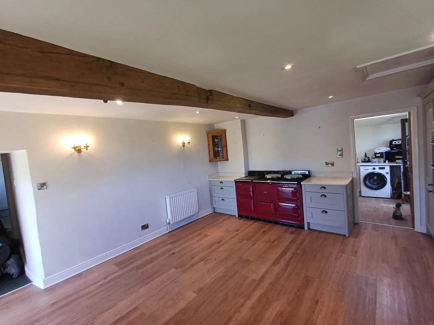 Evenly restored exposed beams showing clearer grain across the finished living space