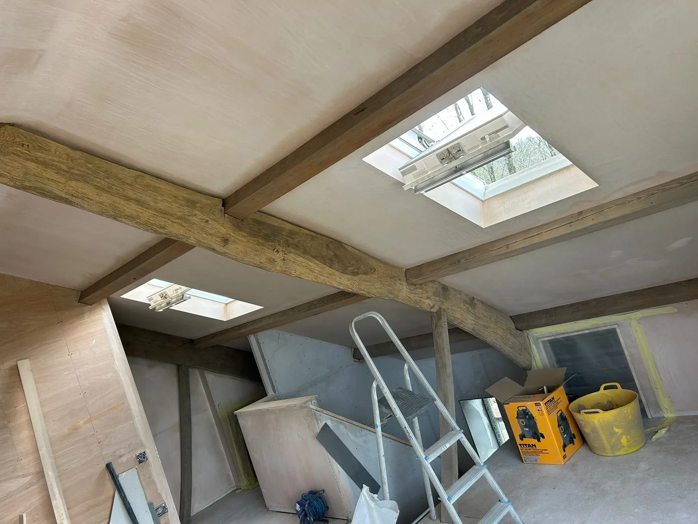 Restored loft conversion oak beams with a clean warm natural timber finish