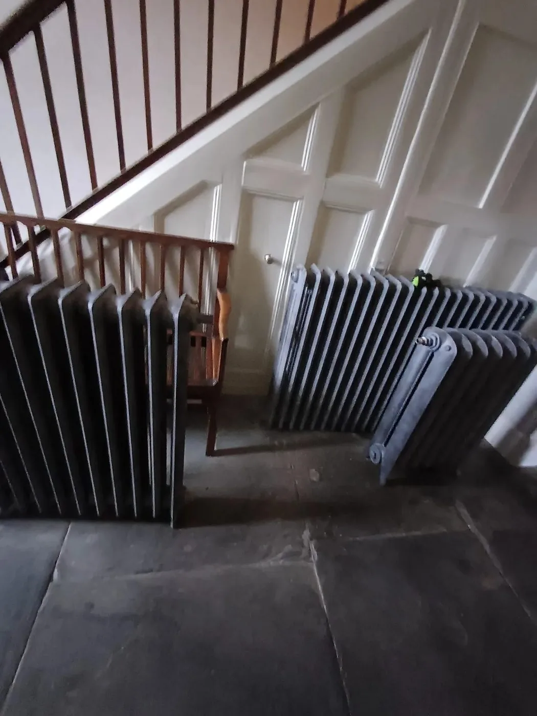 Cleanly restored cast iron radiator with original sections and detailing revealed