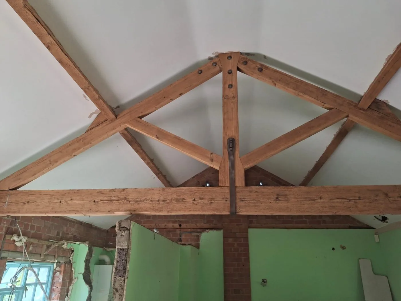 Clean restored oak A-frame with natural grain visible after preparation