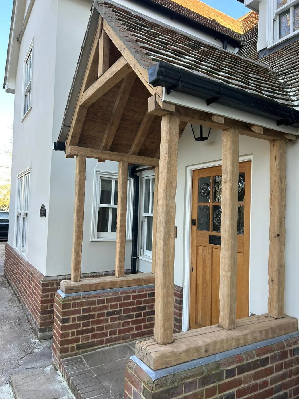 Restored oak porch with brighter timber, clearer grain and an evenly refreshed entrance