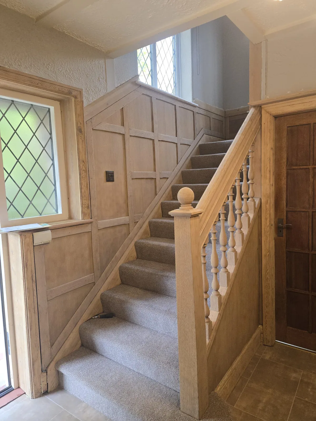 Cleanly prepared staircase and turned spindles revealing an even natural timber surface