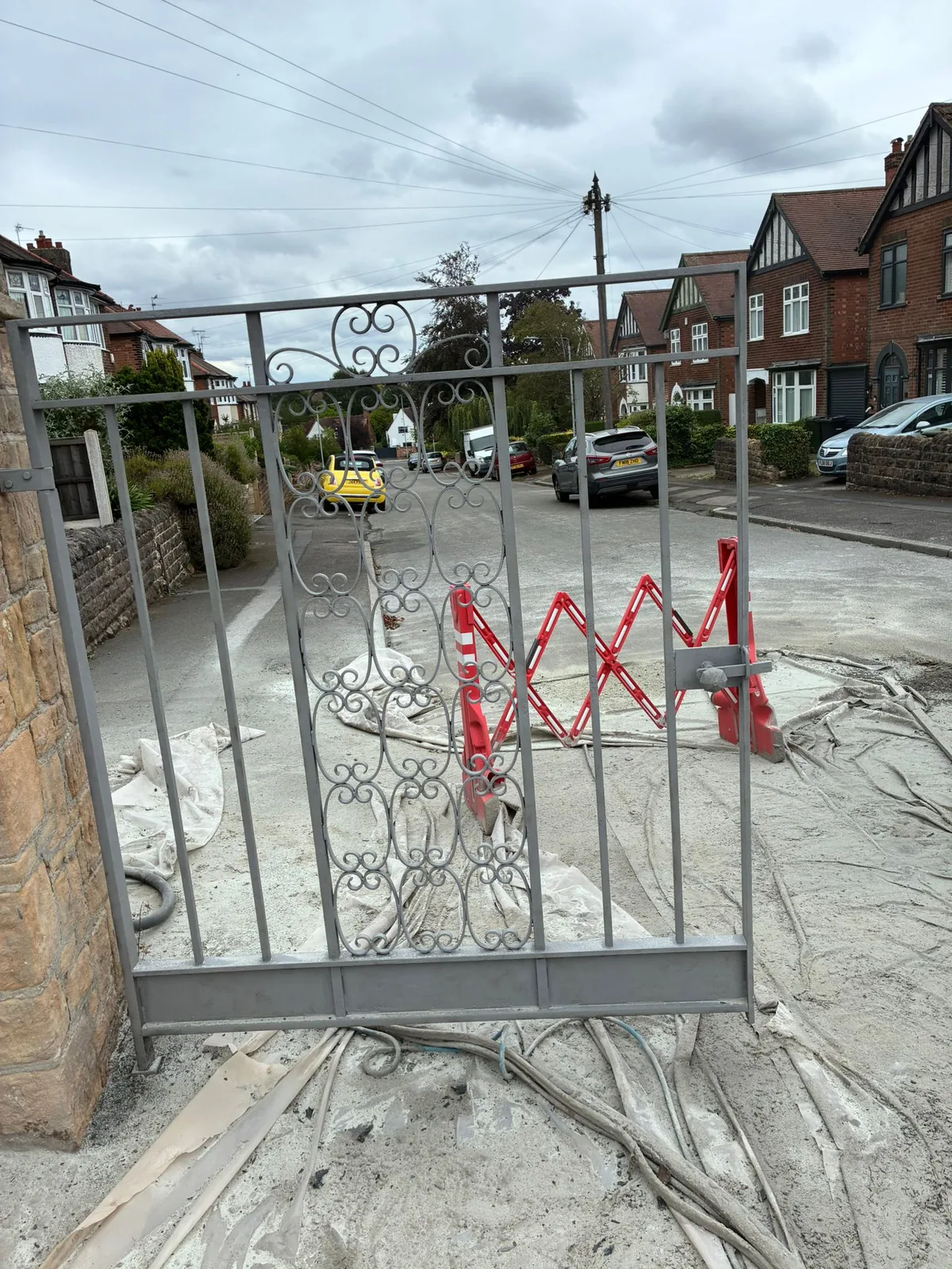 Clean evenly prepared decorative steel gates ready for protective primer and repainting